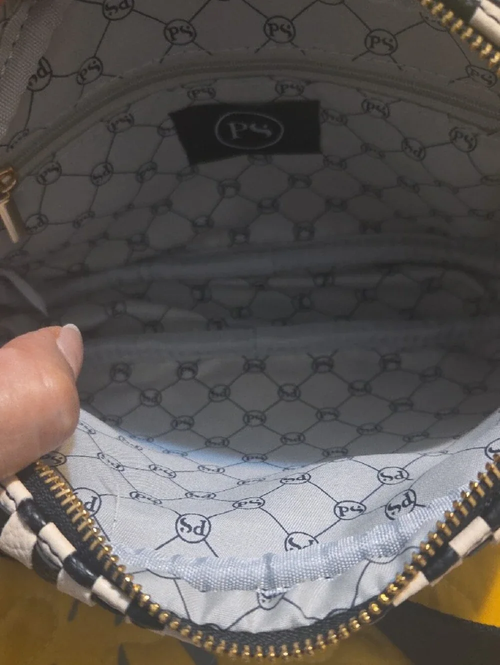 Checkered Black and White Crossbody Bag with Tassel Accent